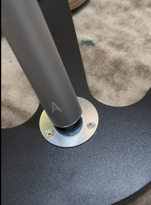 Aluminum post marked A installed into the wooden counter base
