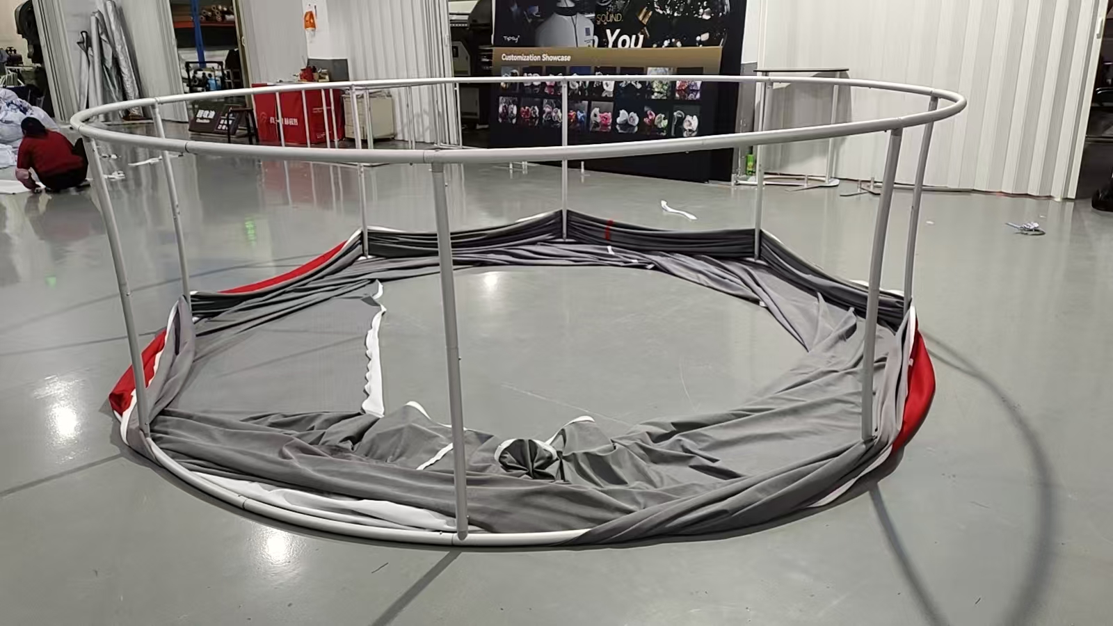 Four meter circular aluminum hanging banner frame during fabric graphic installation