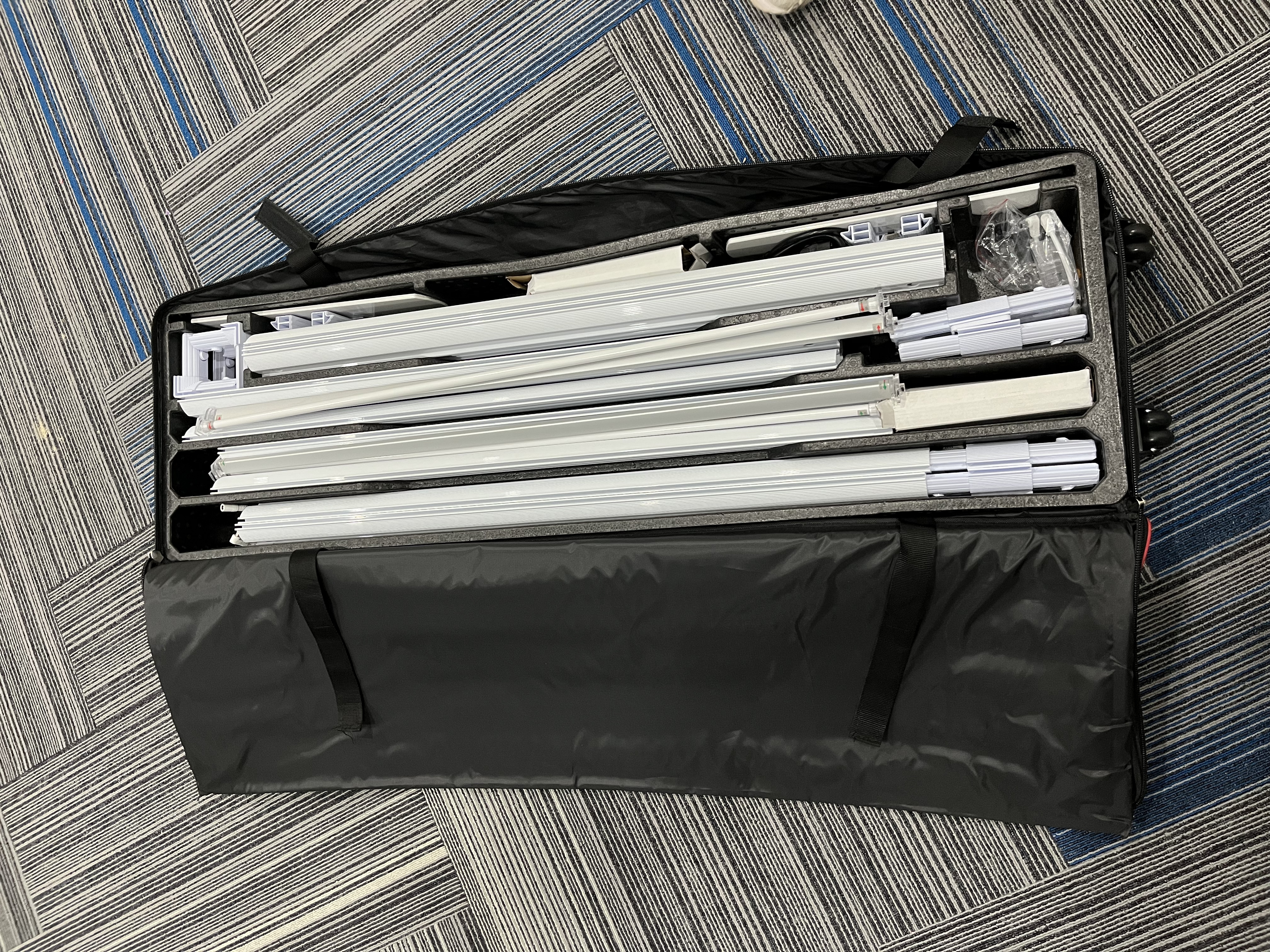 Portable lightbox components stored in a fitted carry case
