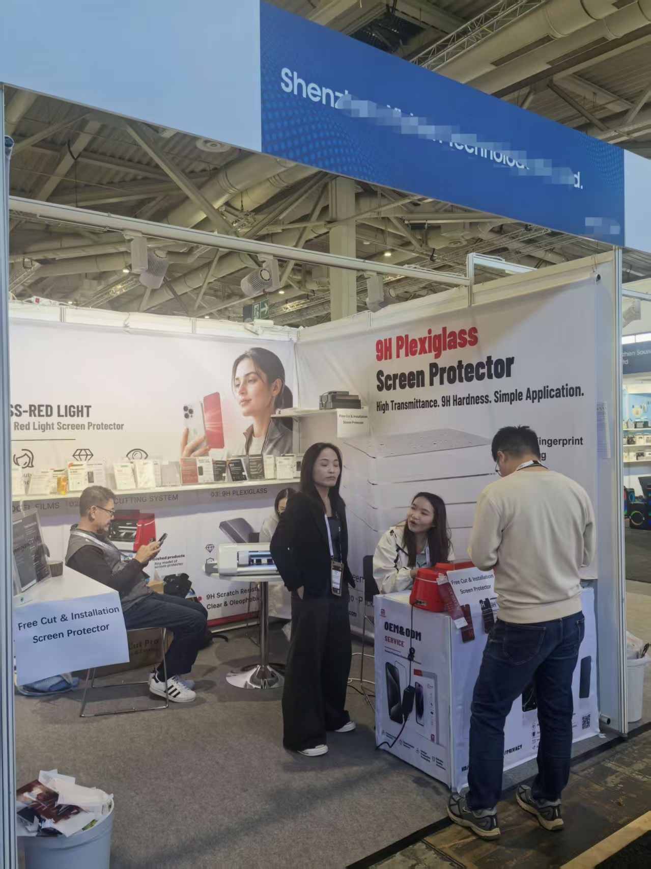 Standard trade show booth in Berlin decorated with custom hanging scroll banner graphics